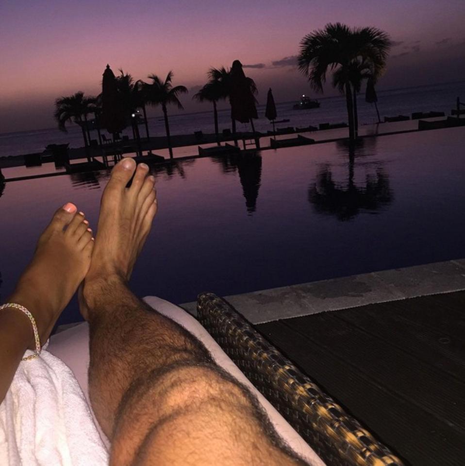  5) OUR Girl shows off her tootsies as she plays footsie with her hunky Essex hubby on holiday