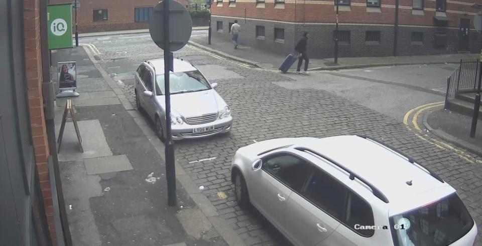  Salman Abedi can be seen here dragging a blue suitcase in new CCTV footage