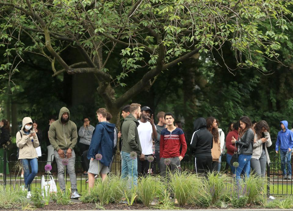  Students gathered after they were forced to evacuate their homes following the identification of the suspect vehicle