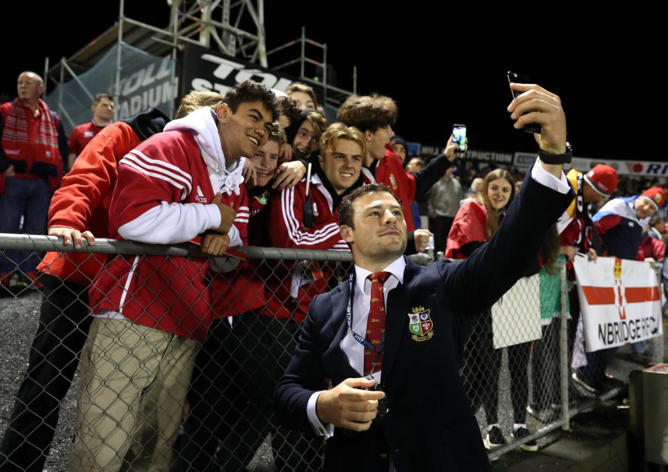 Irish forward Iain Henderson poses with fans before kick-off