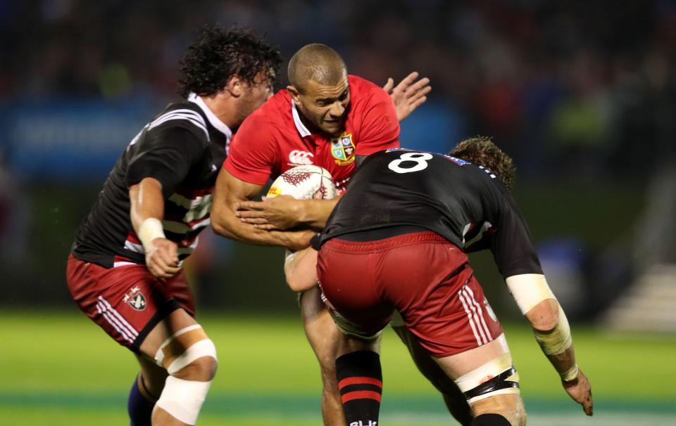 England centre Jonathan Joseph takes a hit from the committed Kiwis