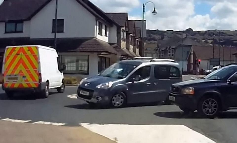  The Peugeot can be seen cutting off the Volvo 4x4 as it drives around the roundabout