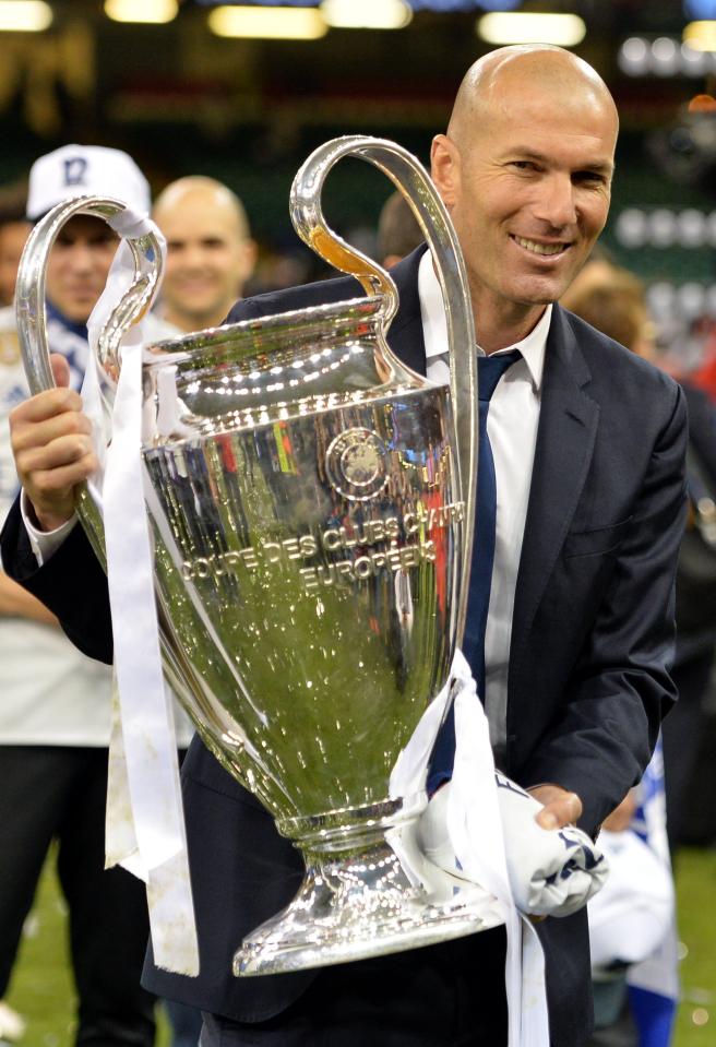  Zinedine Zidane proudly held the trophy as Madrid won their second successive Champions League