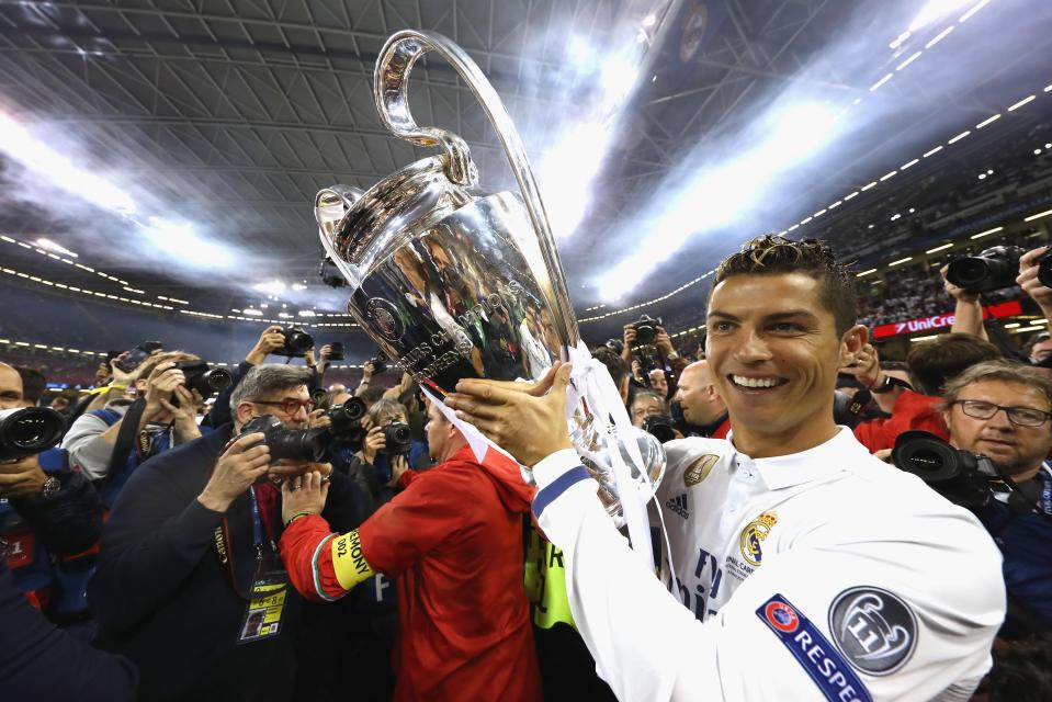  Cristiano Ronaldo holds Champions League trophy aloft