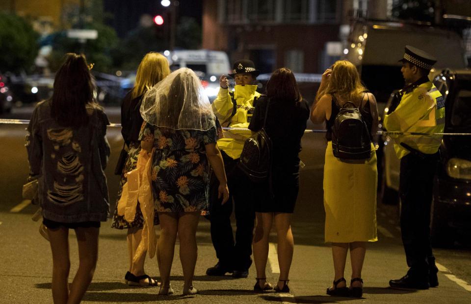  Revellers speak to cops after the knifemen stabbed dozens enjoying an evening out in London Bridge last night