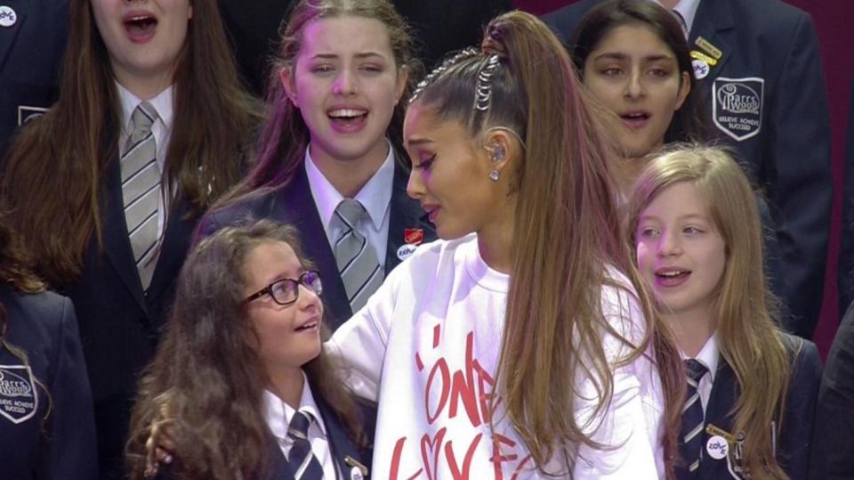 Ariana hugs schoolgirl Natasha-Rose Seth, joined the star to sing her song My Everything