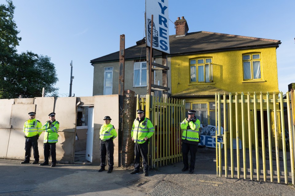 Police could be seen outside a property during the early morning raids