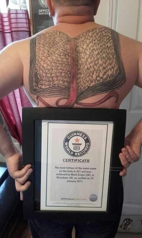  Guinness World Record nut Mark proudly shows off the inking he got to celebrate Lucy's birth