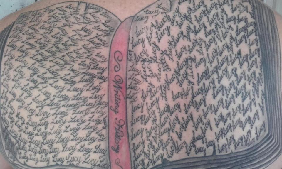  Mark had Lucy's name inked on his back 267 times inside a book that signifies the Guinness Book of Records