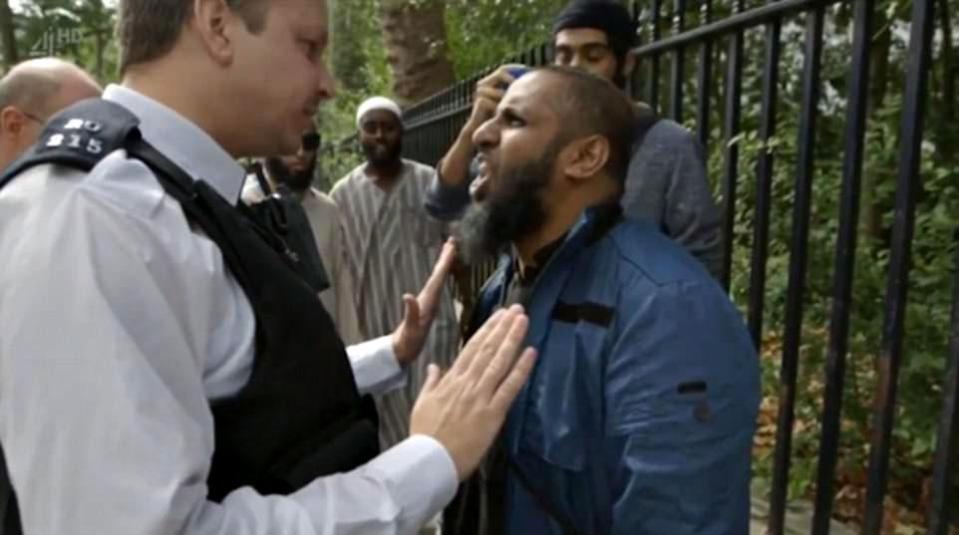 One of the group of radicals shouts in the face of a cop in the Channel 4 documentary 