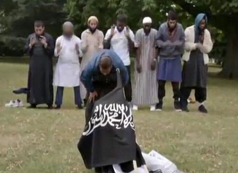 Butt was pictured as part of a group in Regent's Park brandishing a black flag