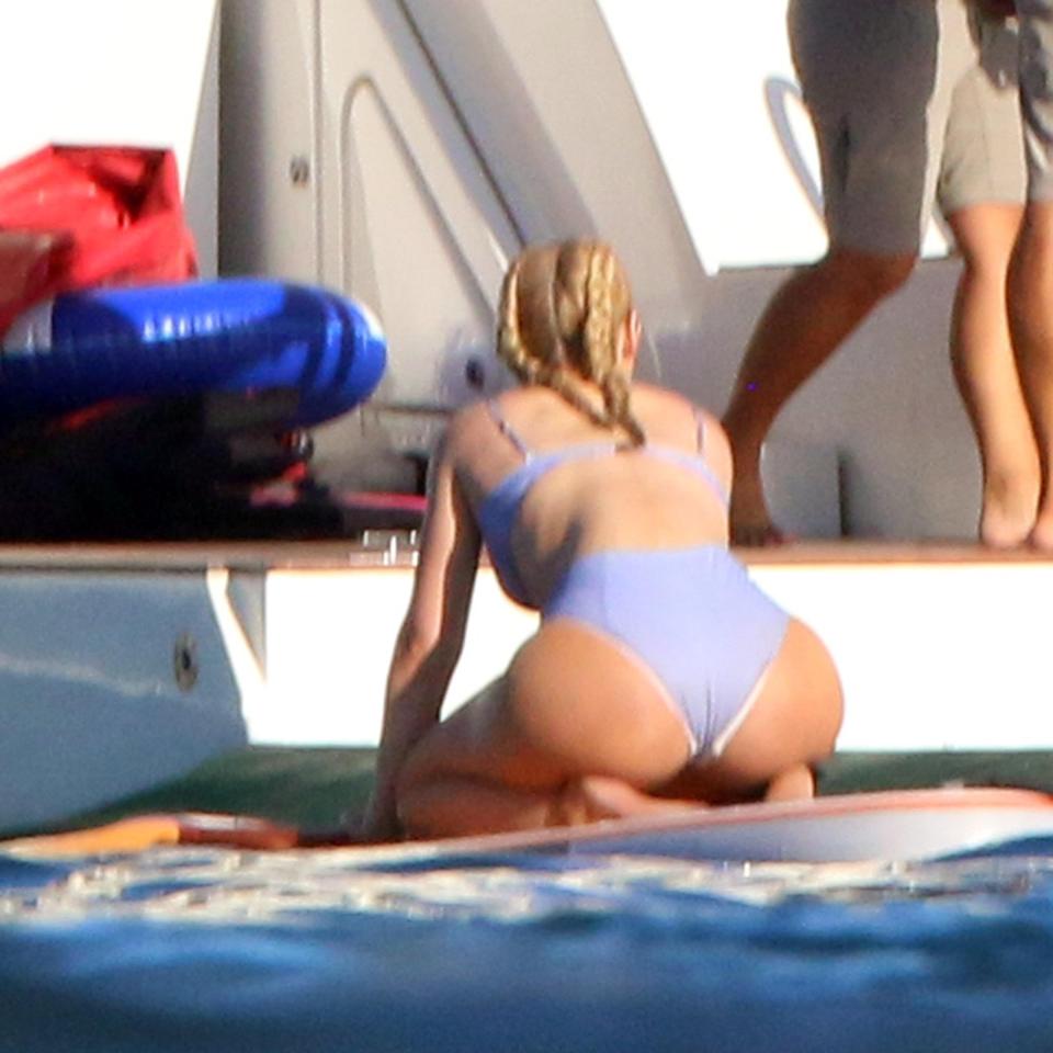  As she knelt on the board, Iggy showed off her rump