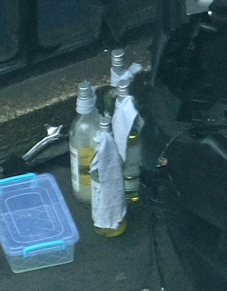  The bottles filled with liquid and with rags tied around the tops - feared to be Molotov cocktails - can be clearly seen here