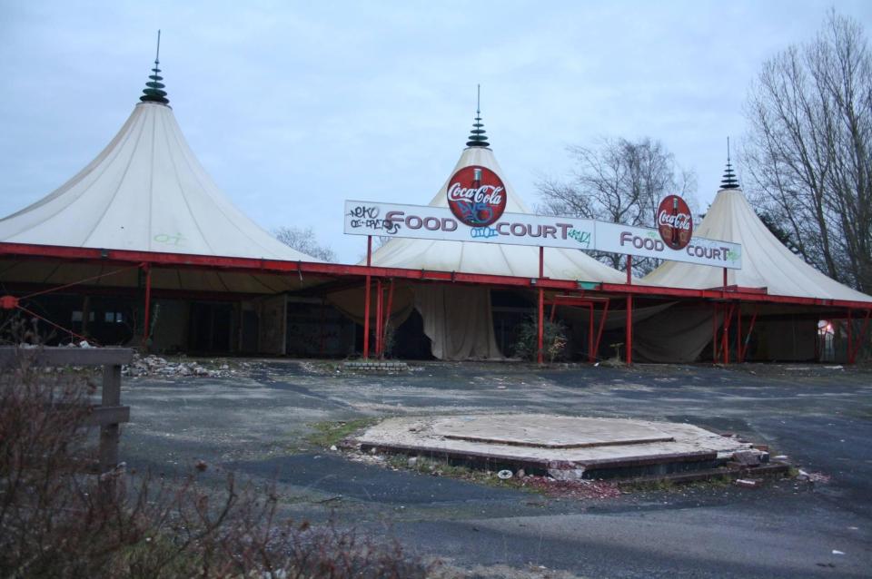  Parts of the canopy of what used to be food court can be seen collapsing