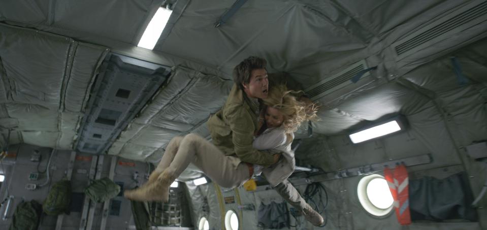  Tom Cruise in an action-packed scene with Annabelle Wallis as Jenny Halsey