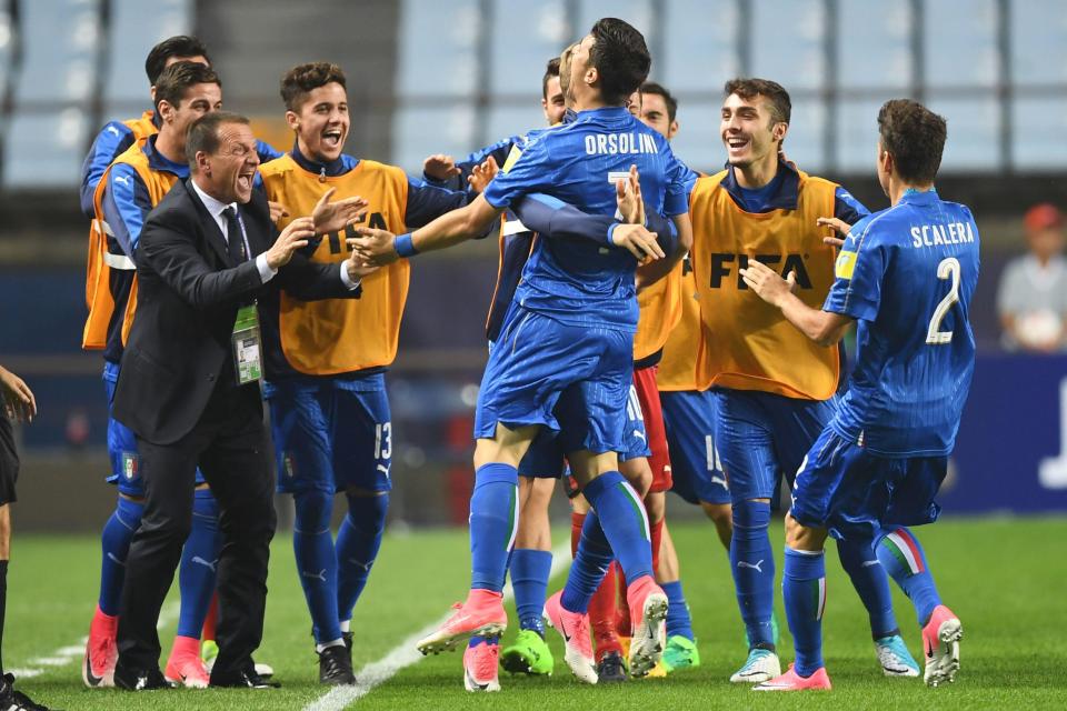 Riccardo Orsolini celebrates after firing Italy ahead on two minutes