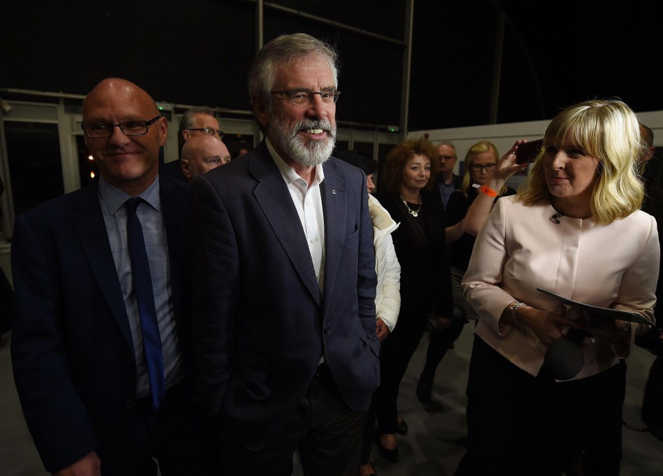 Sinn Fein leader Gerry Adams arrives at a counting hall in Belfast on election night