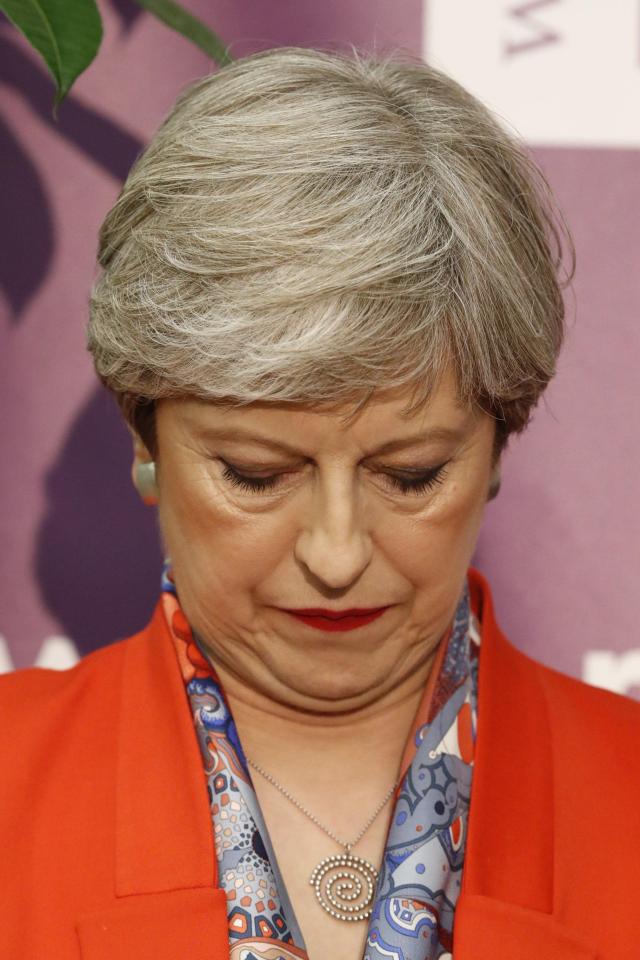  May looks dismayed after a devastating night for her party in the General Election