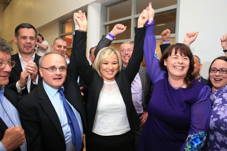 Sinn Fein’s leader in Northern Ireland Michelle O’Neill, centre, celebrates after the party picked up two seats from the SDLP