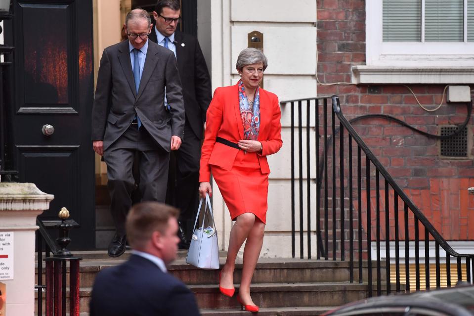  Mrs May with her husband Philip at Conservative headquarters this morning