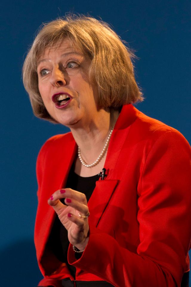  May was also pictured in her signature red suit in February 2015