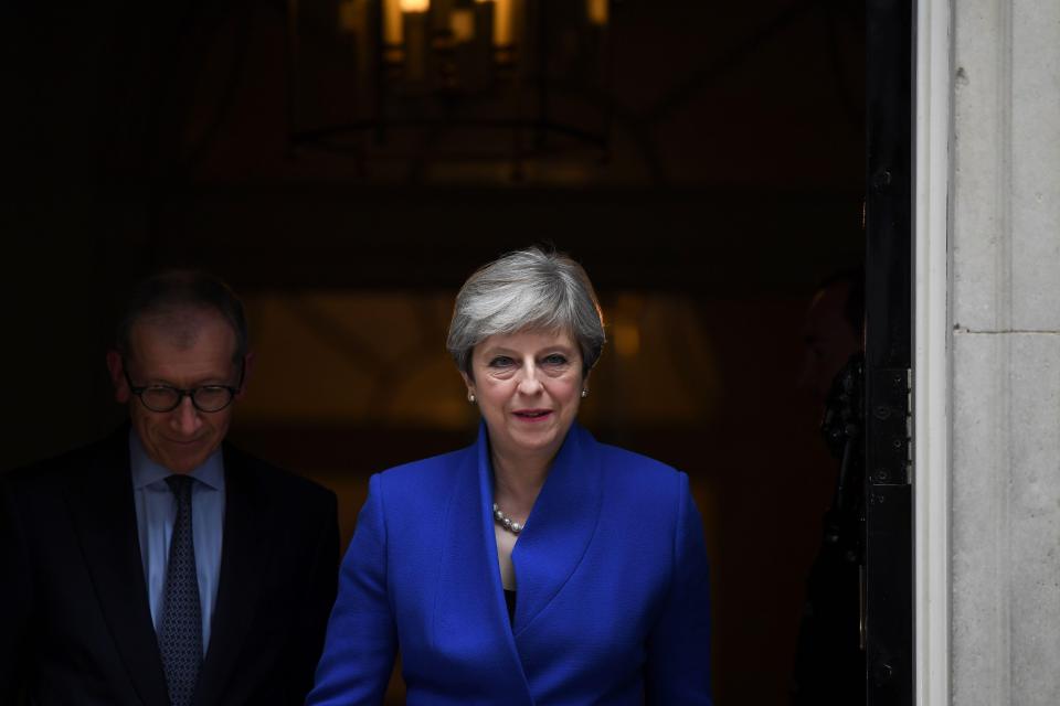  Theresa and Philip May walking through the door of No 10 as they left for the Palace