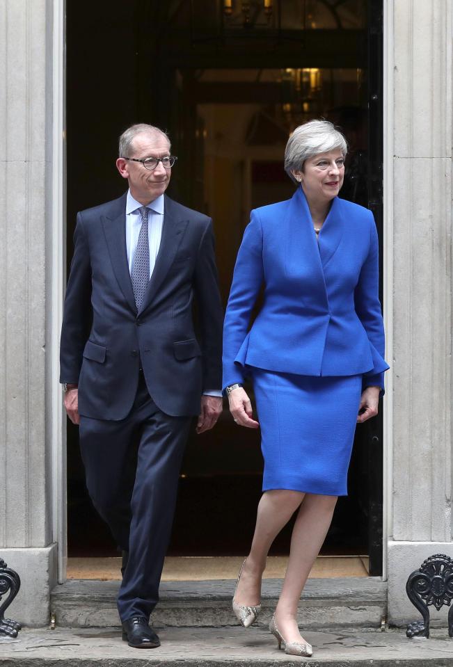  Dressed in a striking blue suit, the PM left Downing Street to visit the Queen at around 12.20