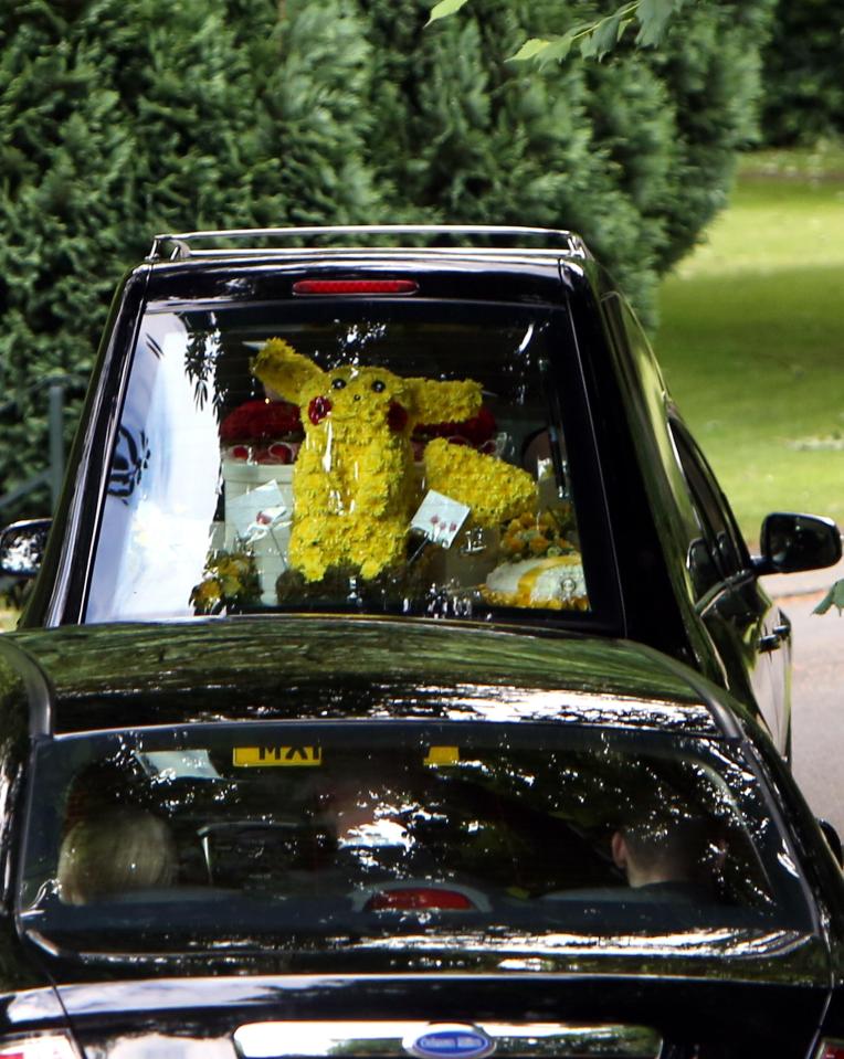  A flower arrangement in the shape of Pokemon character Pikachu was placed in the hearse with Courtney's coffin