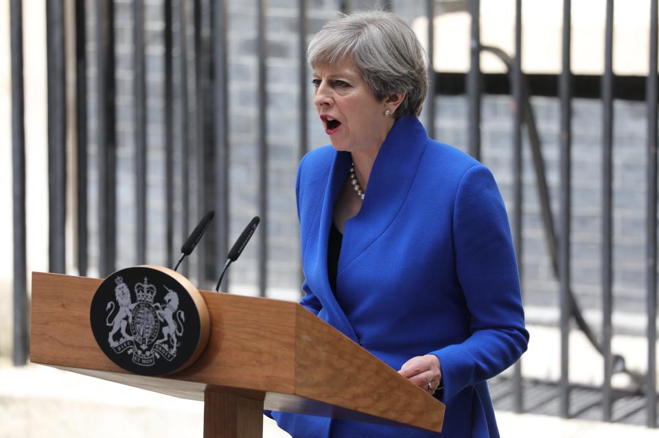 Britain's Prime Minister Theresa May delivers a statement to the media outside No. 10 Downing Street after meeting the Queen in Buckingham Palace in London