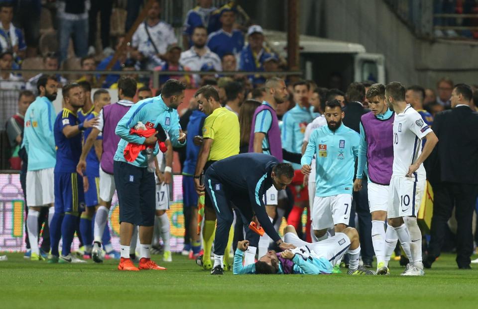  Greece midfielder Giannis Gianniotas had his tooth knocked out by Bosnia coach Stephane Gilli