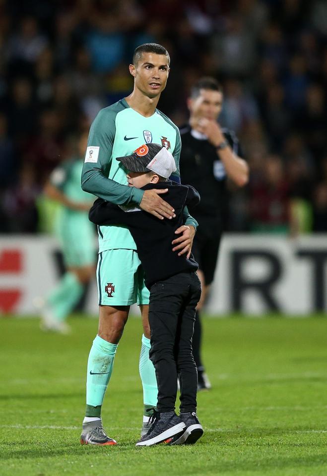  A young Latvia supporter ran onto the pitch to show his appreciation for one of the greatest ever players