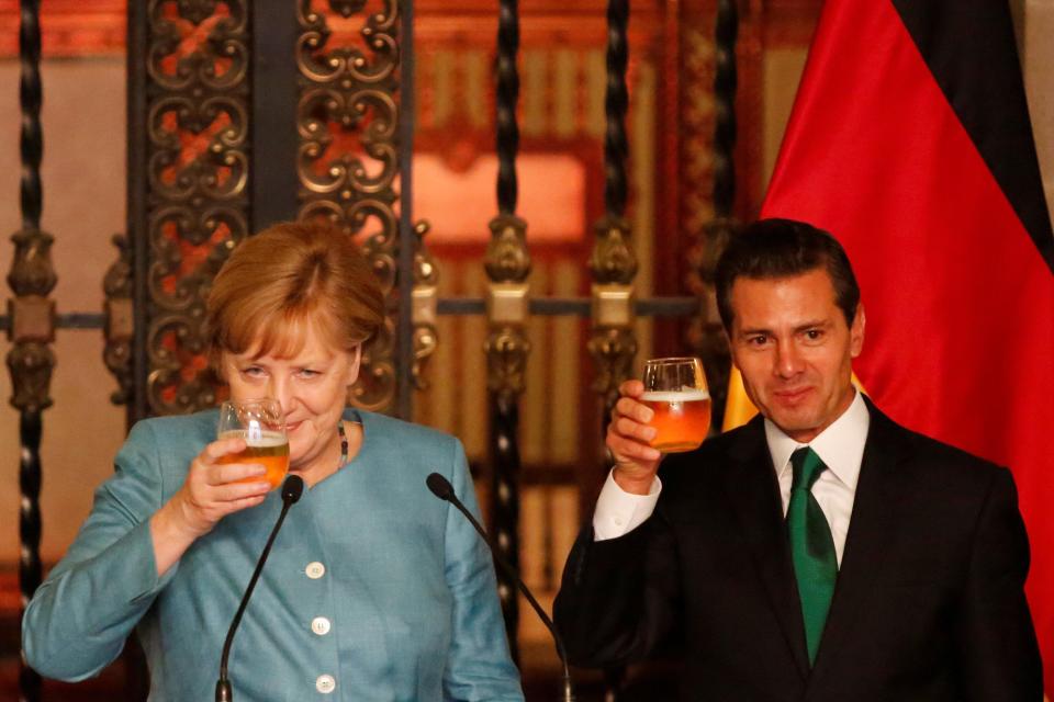  She enjoys a beer with Mexico's President Enrique Pena Nieto