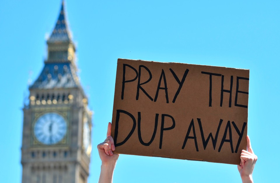 A protest sign waved in the sky, with Big Ben seen in the background