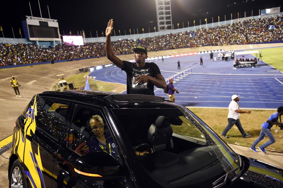  Usain Bolt waved from a Land Rover in his emotional farewell