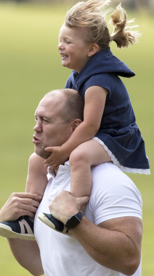 The toddler hitched a ride on her dads shoulders at the one stage during the festival