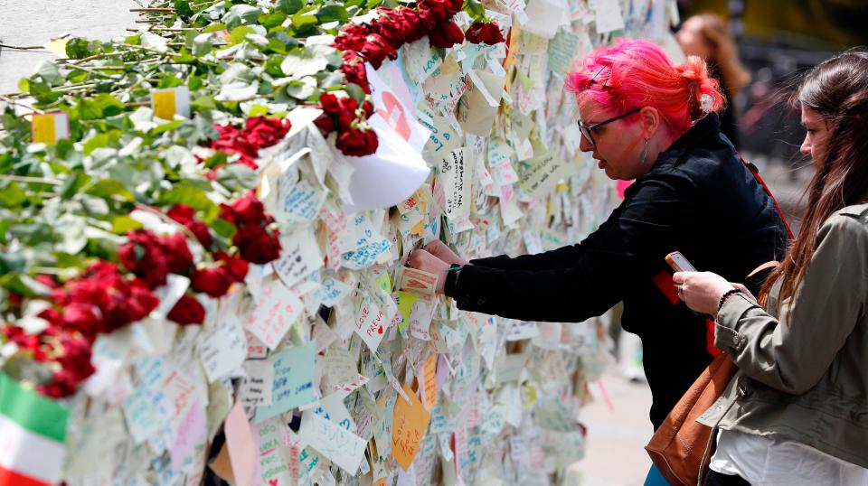  Tributes to the victims of the atrocity were left near the bridge and iconic market