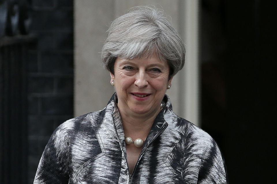  Theresa May faces calls to cut controversial policies in a bid to garner more support