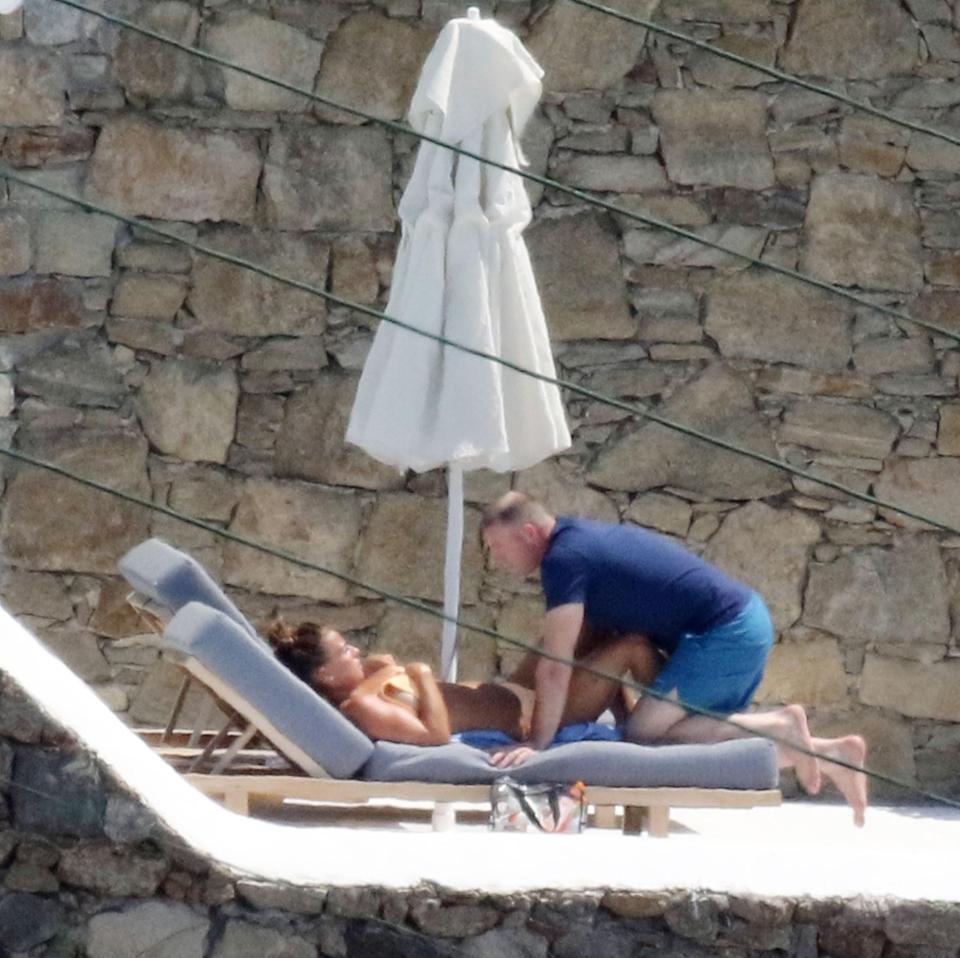  Wayne Rooney hops on Coleen's sunbed in Mykonos