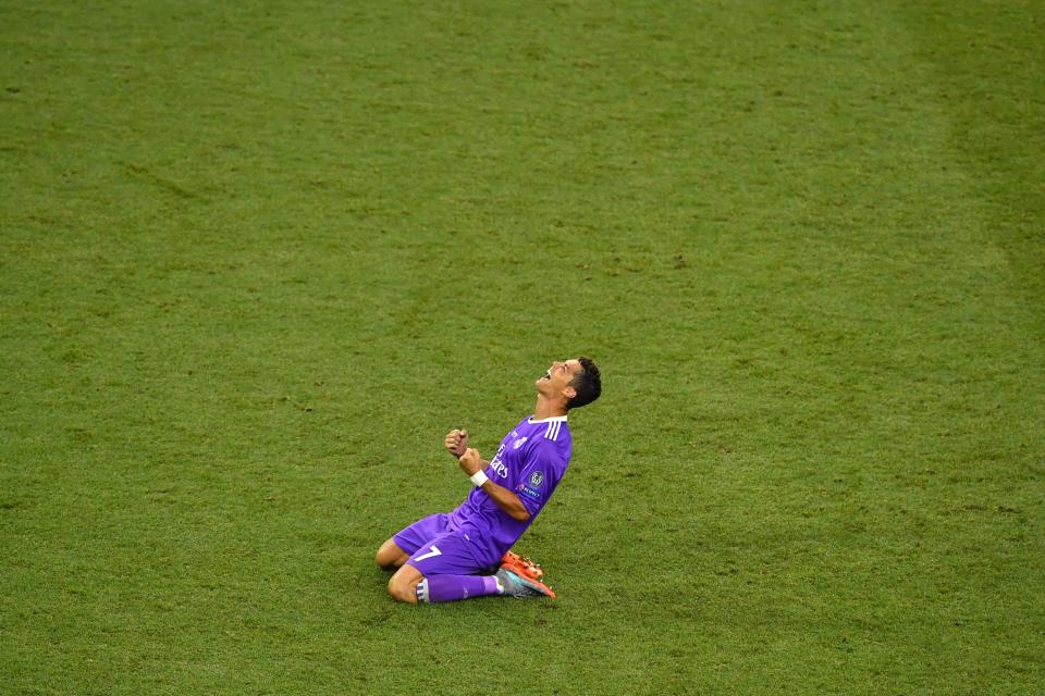  Cristiano Ronaldo celebrates as Real Madrid win Champions League in summer