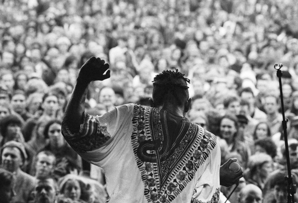  A shot from 1993 shows a singer dancing in a traditional African-style robe. By this time, Glaso was drawing crowds of 80,000