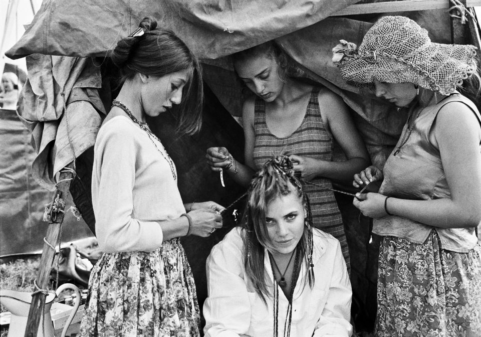  A snap from 1992 shows attendees braiding hair outside a tent. The festival profits were donated to Oxfam and Greenpeace, rather than the CND, for the first time