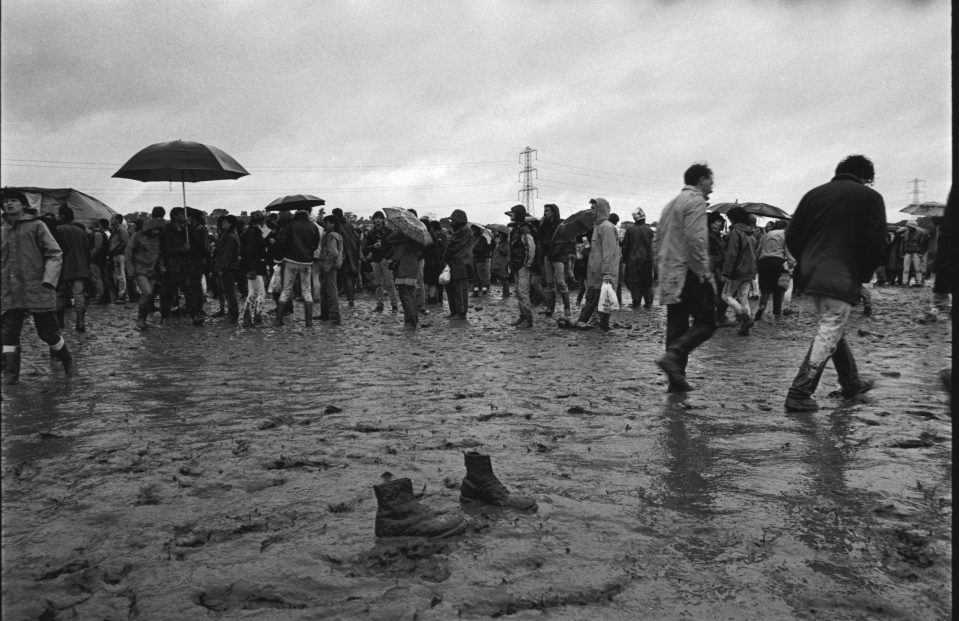  A shot from 1985 shows a pair of boots left behind in the famous Glasto mud. By this time, Worthy Farm was too small for the number of attendees, so nearby farmland was bought to expand the grounds