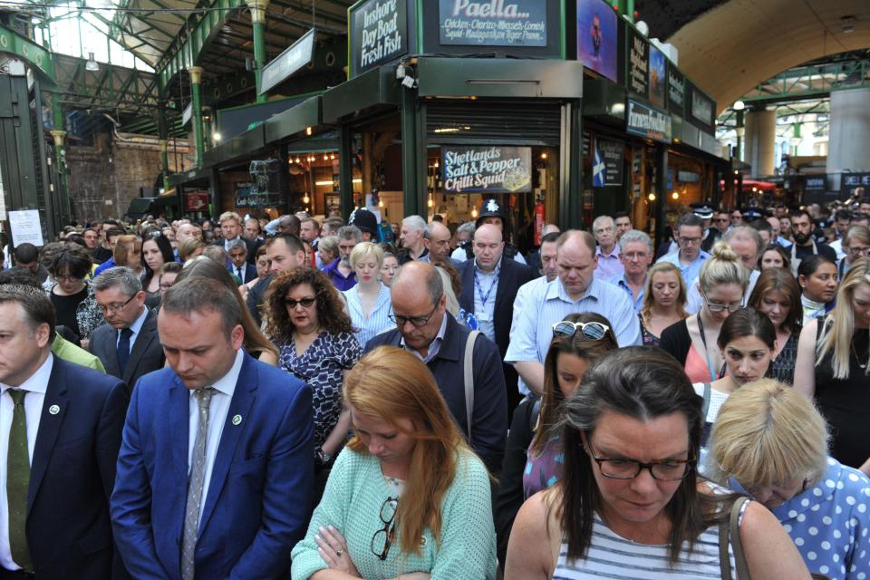  Many bowed their heads as they fell silent for one minute to remember the victims of the terror attack on June 3