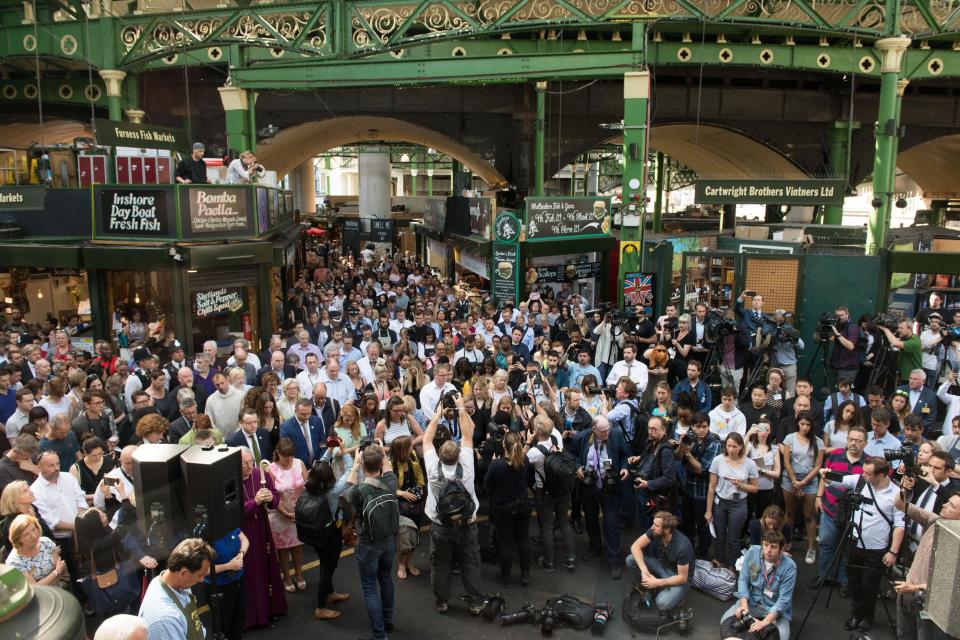  Traders, locals, members of the police and the world's media gathered to observe the silence