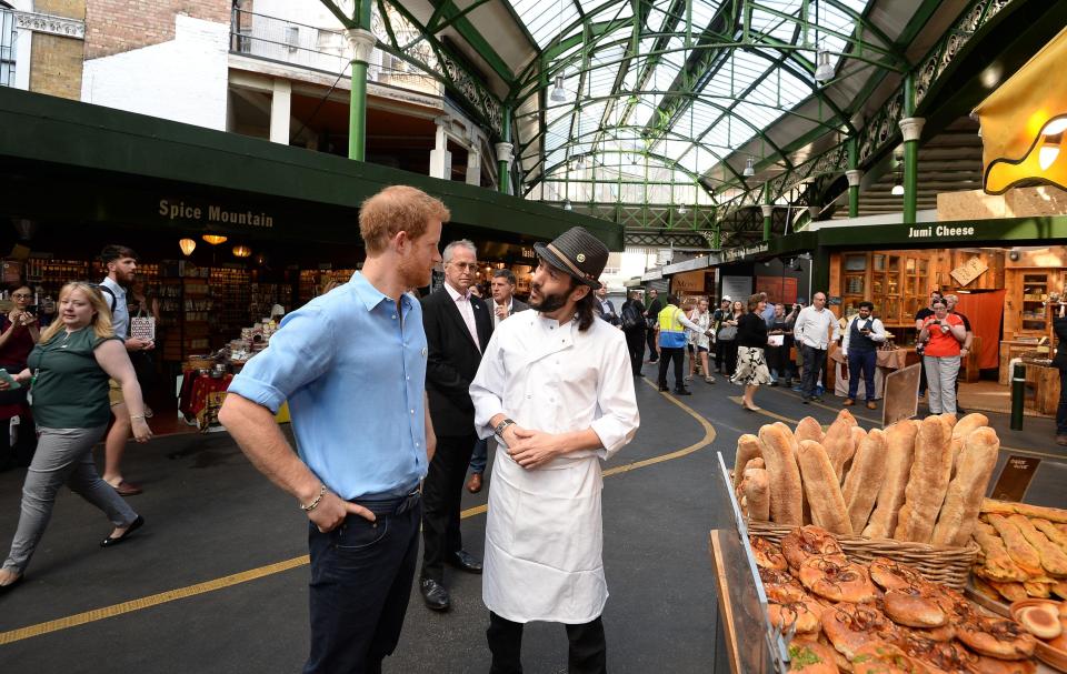  Prince Harry chats to a trader in London's Borough Market this morning