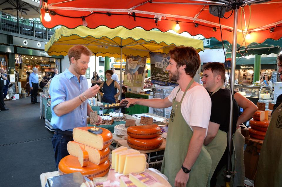  Harry tucks into some gourmet cheese in the market's main hall