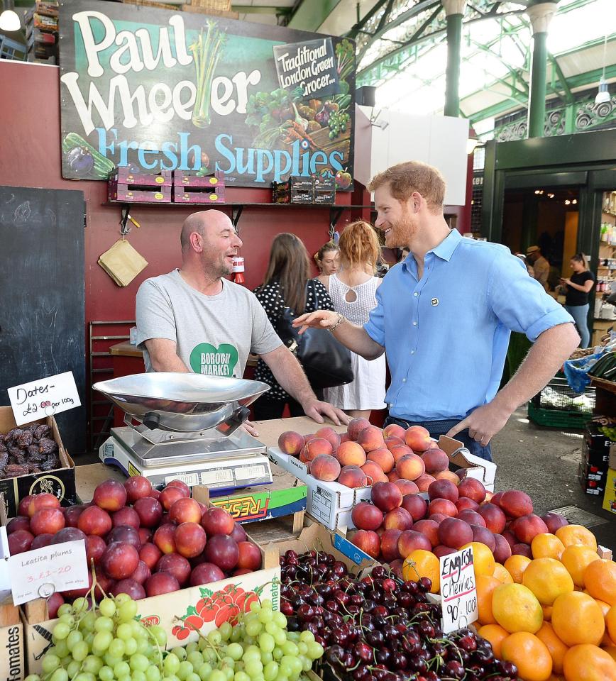  Prince Harry shares a jokes with Paul Wheeler, who rang the market bell yesterday to mark the reopening