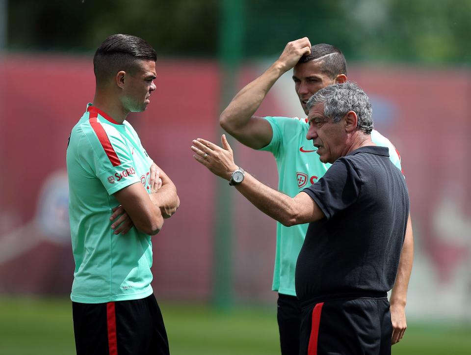  Portugal defender Pepe (L), head coach Fernando Santos (R) and Ronaldo talk tactics