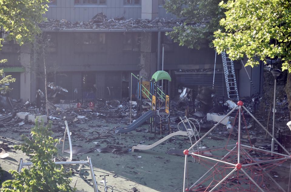  The wreckage lies at the scene where 30 people are confirmed to have died