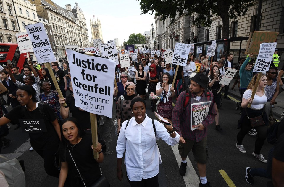 Thousands of angry protesters holding placards calling for 'Justice for Grenfell' marched on Whitehall today as they demanded answers over the disaster